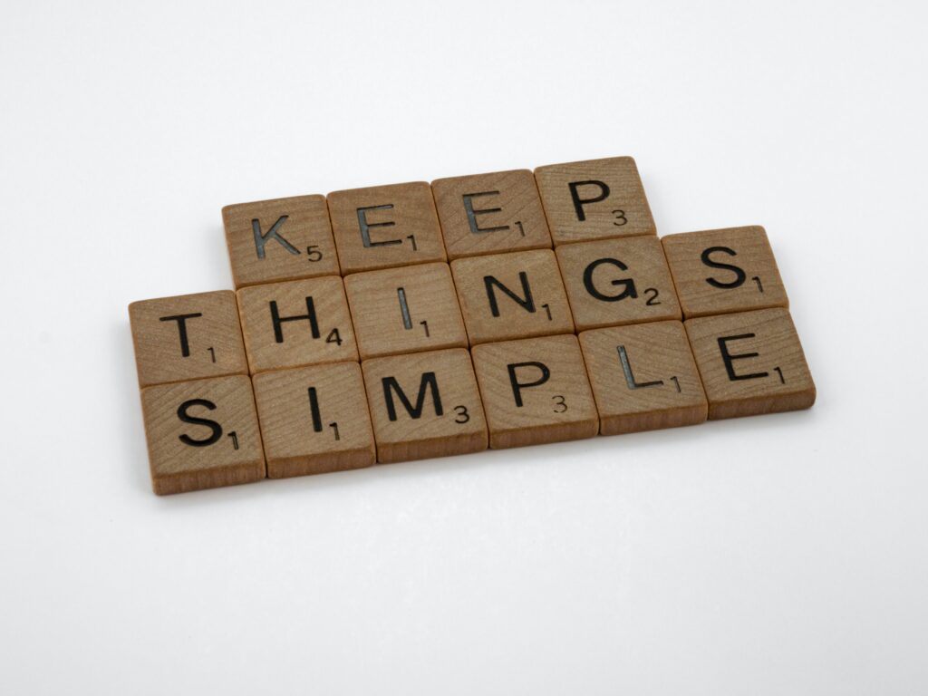 An image of scrabble tiles that read, "keep things simple"