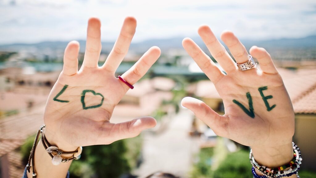 Image of hands with the word LOVE written on the palms